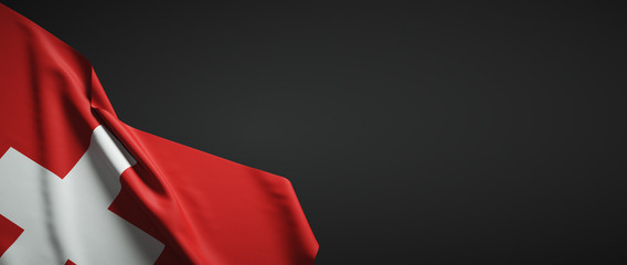 Switzerland flag fabric on plain dark background