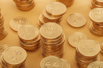 golden coins with dollar signs isolated on orange, st patrick day concept