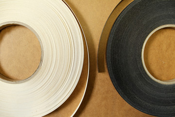 Plastic and paper edge for pasting furniture.