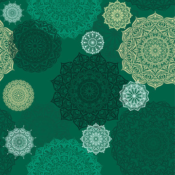 Seamless vector background with lace pattern in dark green colors
