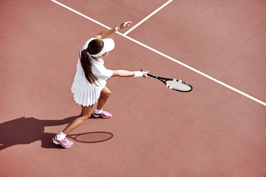 Tennis is her passion. Brunette is completely involved in the game