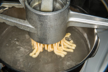 German noodle machine for spaetzle pressing noodles in cooking water
