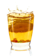 A glass of cold drink with lemon. Splash, splash fluid. Isolated.