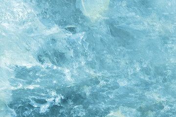 Horizontal lightened slices of blue marble quartz ice background. Cold calm colors icy background ideal for your design