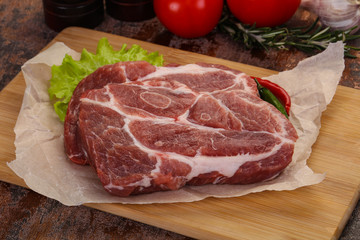 Raw pork neck steak