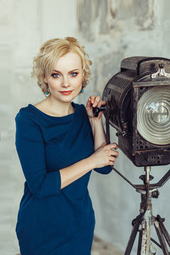 Close up portrait of art creative talanted person. Young blondie woman, smiling, looking at camera in studio