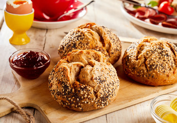 Brown bread buns with seeds served for breakfast
