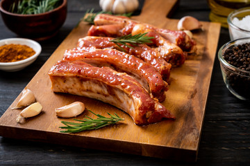 Fresh raw pork ribs ready for roasting with ingredients