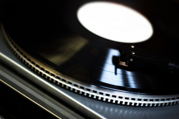 Turntable vinyl record player is playing music
