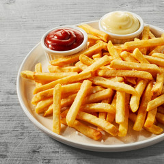 Plate of golden French fries or Pommes Frites