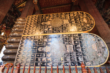 Beliefs in 108 Auspicious Symbols in the Lord Buddha’s Footprint of The Reclining Buddha of Wat Pho, came from ancient scripture of Sri Lanka. Thailand Object of Worship revered by Thai and foreigners