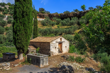 Fototapeta na wymiar old byzantine chapel on the medieval graveyard near Kardamyli, Messenia