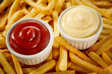 Side servings of tomato sauce and mayonnaise