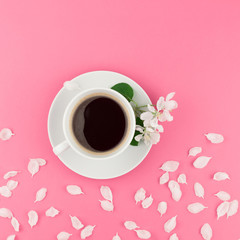 Obraz na płótnie Canvas Flat lay of coffee and white flowers petals