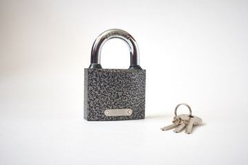 Cast iron padlock with bunch of keys isolated on white. Concept security.