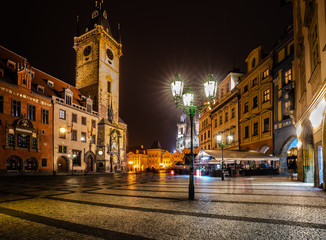 View of Old Town Square and Prague Astronomical Clock at night in Prague, Czech Republic.