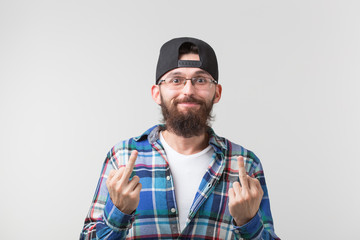 Portrait of funny man showing middle finger gesturing fuck on white background