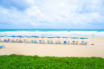 Beach summer holiday with chair and umbrella 