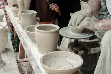 Fototapeta na wymiar Artist makes handmade clay pots