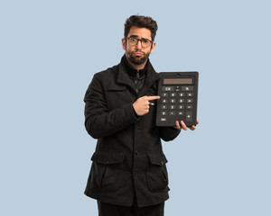young man holding a calculator