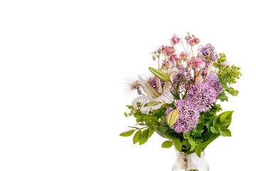 Bouquet of fresh spring flowers, white lily, decorative onion balls, aquilegia, cuff, Lady's Mantle in a glass jar isolated