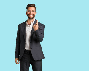 Young handsome business man inviting to come