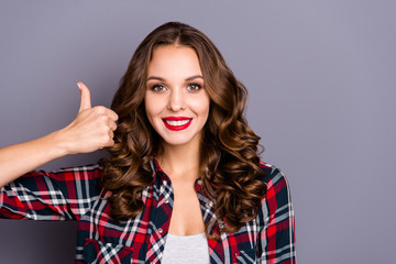 Close-up portrait of nice cute attractive charming pretty winsome cheerful cheery wavy-haired lady cool shine look showing thumbup isolated over gray pastel violet background