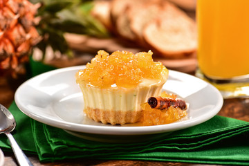 Pineapple individual cheesecake on decorated scene