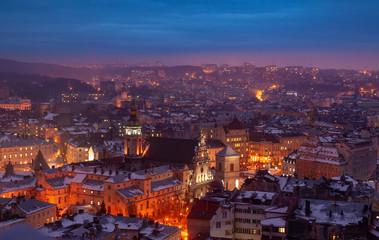 Fototapeta na wymiar Aerial panoramic view of historical city center at night, Lviv, Ukraine. UNESCO world heritage site