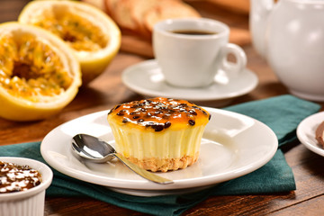 Passion fruit individual cheesecake on decorated scene