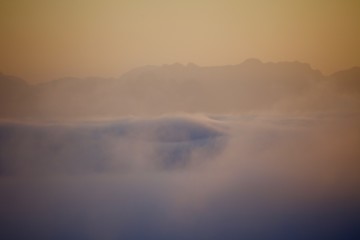 Above the clouds in the mountains