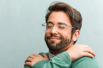 Young handsome entrepreneur man face closeup proud and confident, pointing fingers, example to...