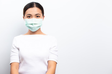 Asian women wear protective masks isolated over white background