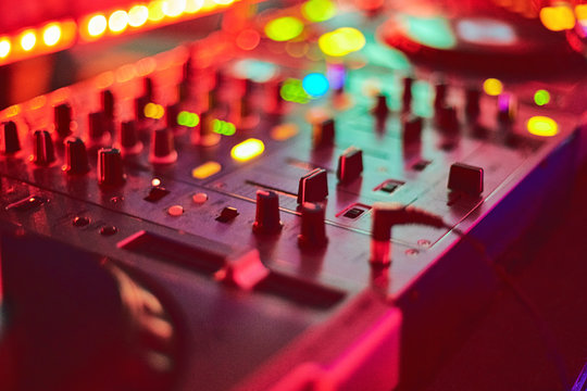 DJ playing box with mixing music on turntables and vinyl records