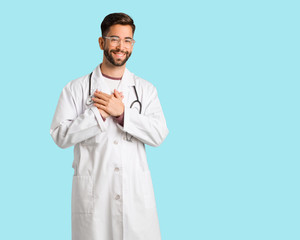 Young doctor man doing a romantic gesture