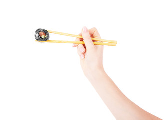 Hand holds sushi and sushi roll on a white background