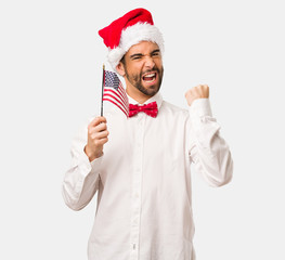 Young man wearing a santa claus hat on Christmas day