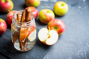Apple and cinnamon detox drink in jar. Selective focus.