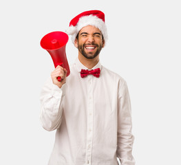 Young man wearing a santa claus hat on Christmas day