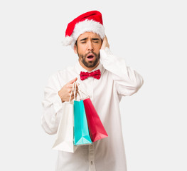 Young man wearing a santa claus hat on Christmas day