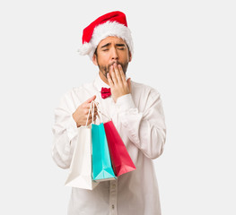 Young man wearing a santa claus hat on Christmas day