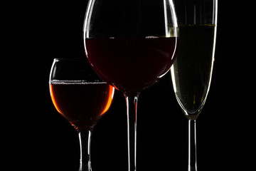 Glasses of wine in darkness