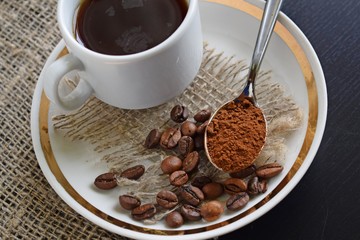 Fragrant coffee in a white Cup on a burlap.