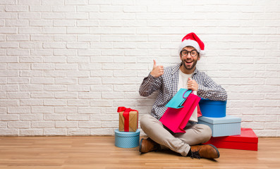 Young crazy man celebrating christmas in his house