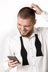 portrait of bearded businessman uses smartphone on white background