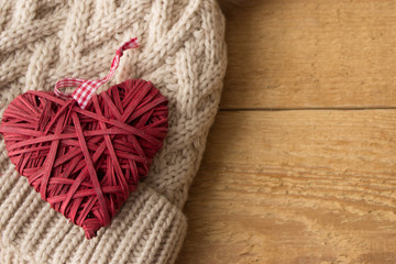 The Valentine Day Concept. Wicker red heart top on the winter hat. Copy space area