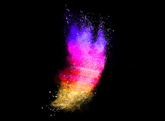 Colorful powder explosion on black background.