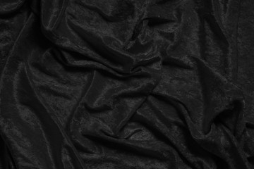 Fototapeta premium crumpled luxurious black velvet drape background texture