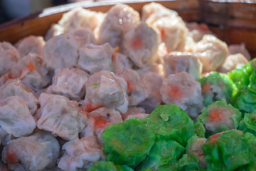 Closeup Dim Sum ,Chinese food steamed dumpling on bamboo background.
