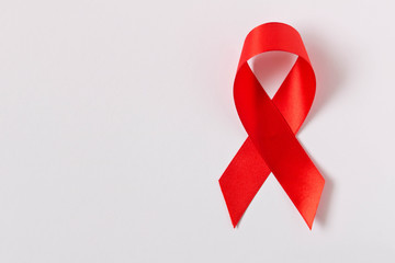 Red aids ribbon.  Isolated on white background with empty space for text.